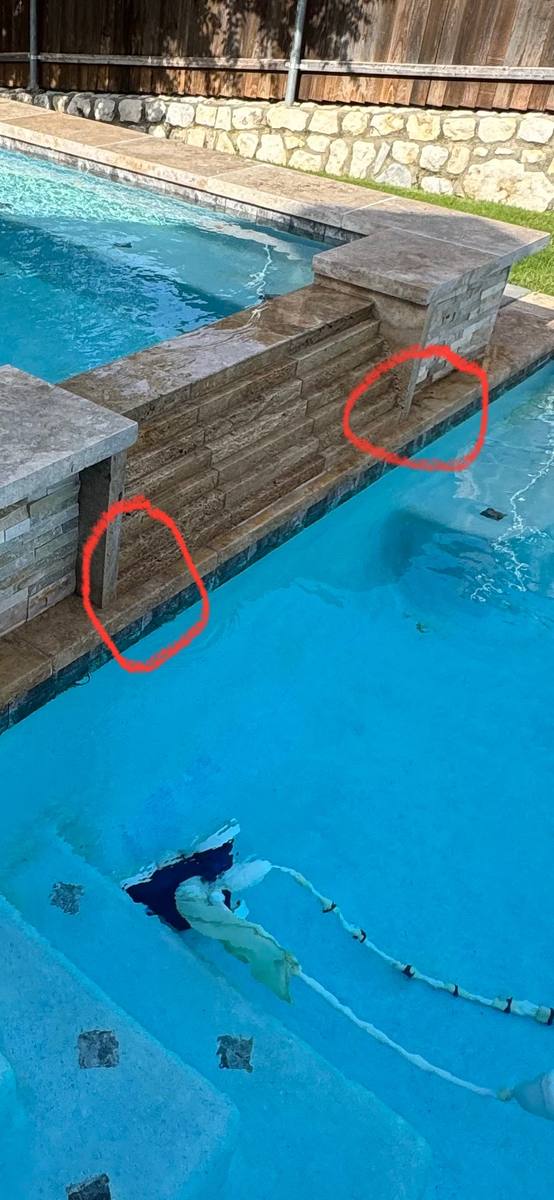 Pool tile line marked for repair